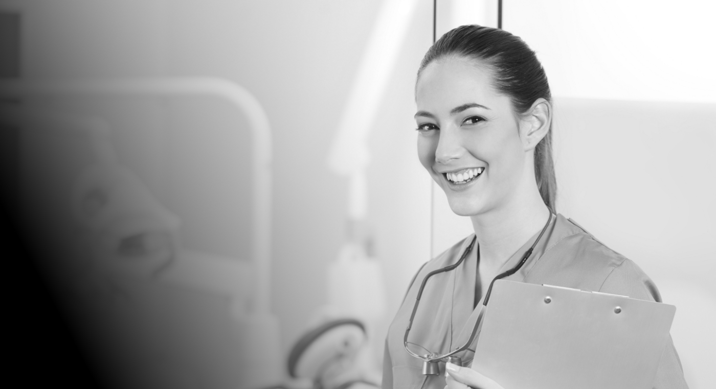 Smiling woman in scrubs with a dental career in Arlington