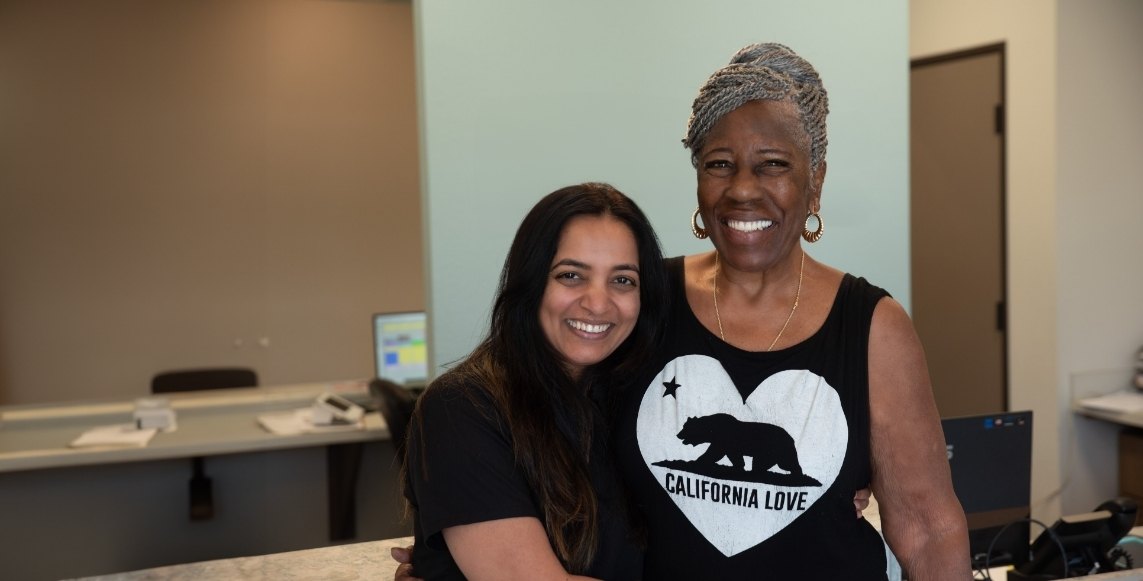 Woman smiling with Arlington dental team member