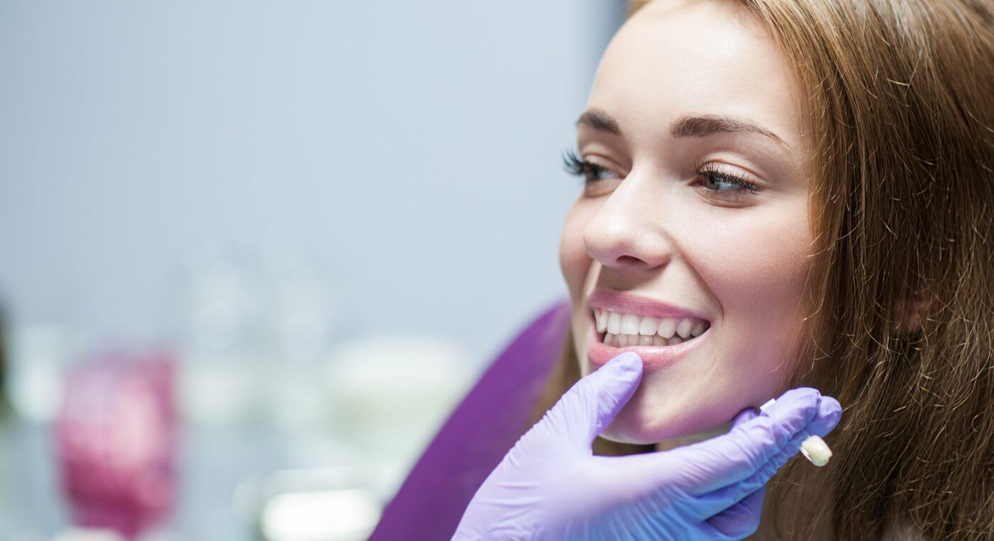 Woman smiling after receiving restorative dentistry in Arlington